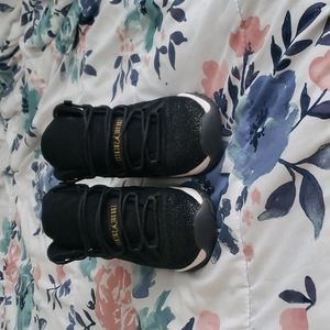 Jordan 11 heiress black and gold